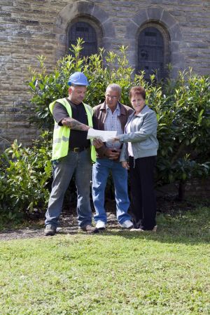 Alan and his parents locating Cicely's Grave, Row 9, Grave 28